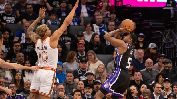 Feb 22, 2024; Sacramento, California, USA; Sacramento Kings guard De'Aaron Fox (5) takes a shot over San Antonio Spurs forward Jeremy Sochan (10) during the fourth quarter at Golden 1 Center. Mandatory Credit: Ed Szczepanski-USA TODAY Sports